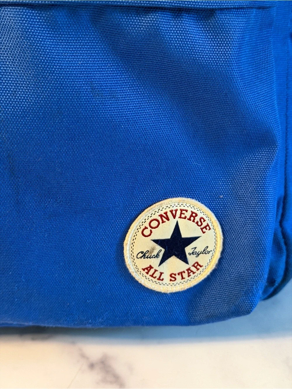 Converse All Star backpack in blue with classic Chuck Taylor logo patch.